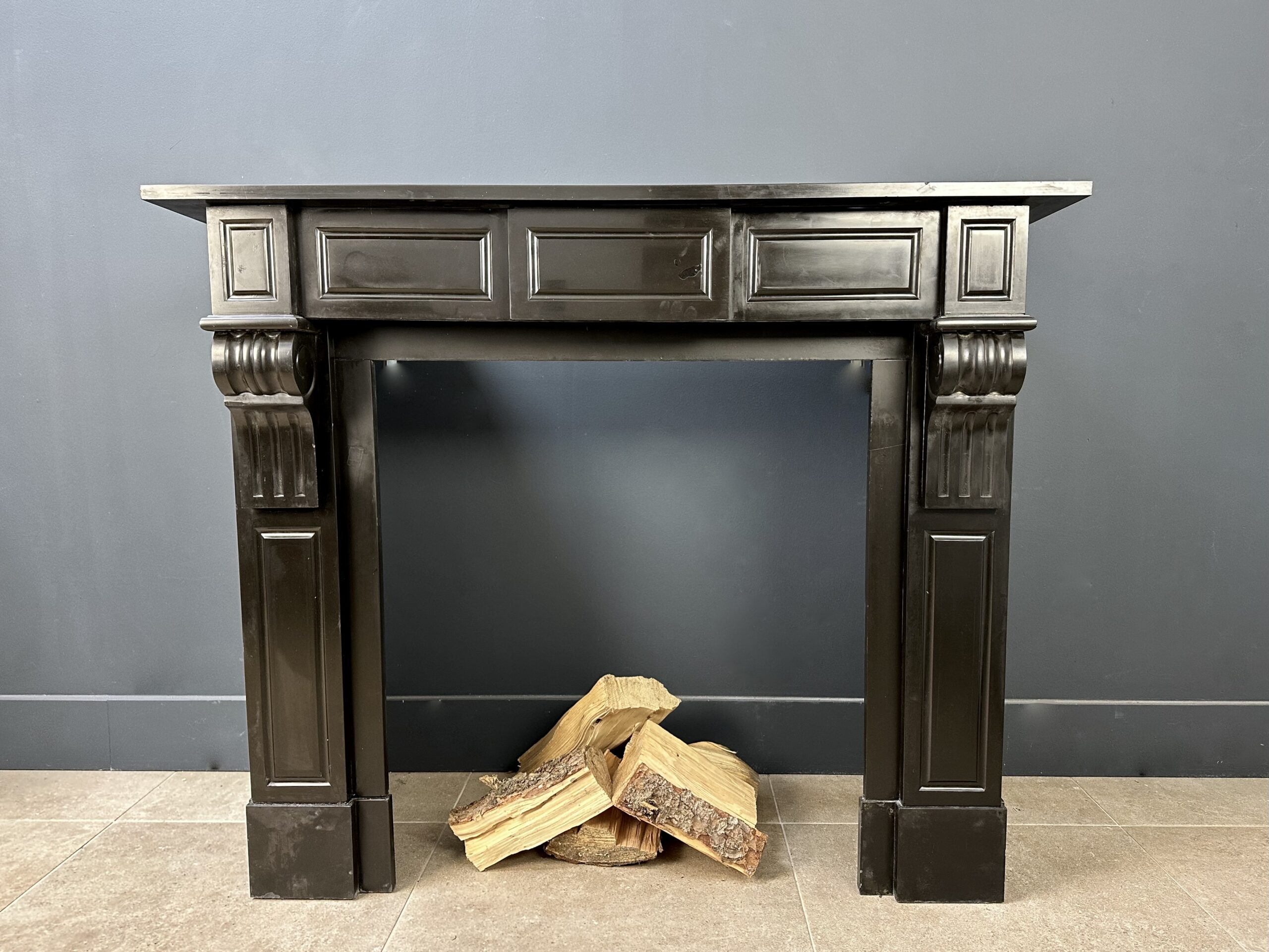 small antique black fireplace